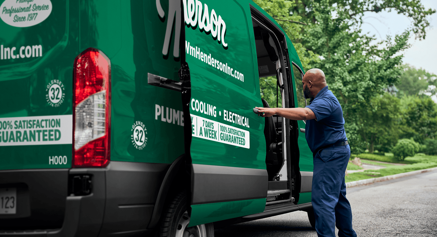 A professional Henderson technician opening a service van on a residential street, ready to provide home HVAC, plumbing, and electrical services.